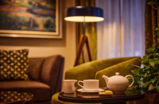 pre-cta tea seat on nightstand and lamp on in background